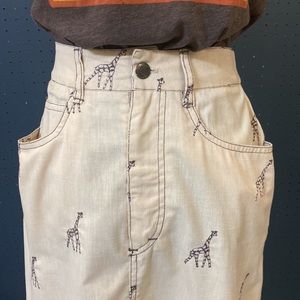 Cute vintage tan jean style midi skirt with embroidered giraffes
